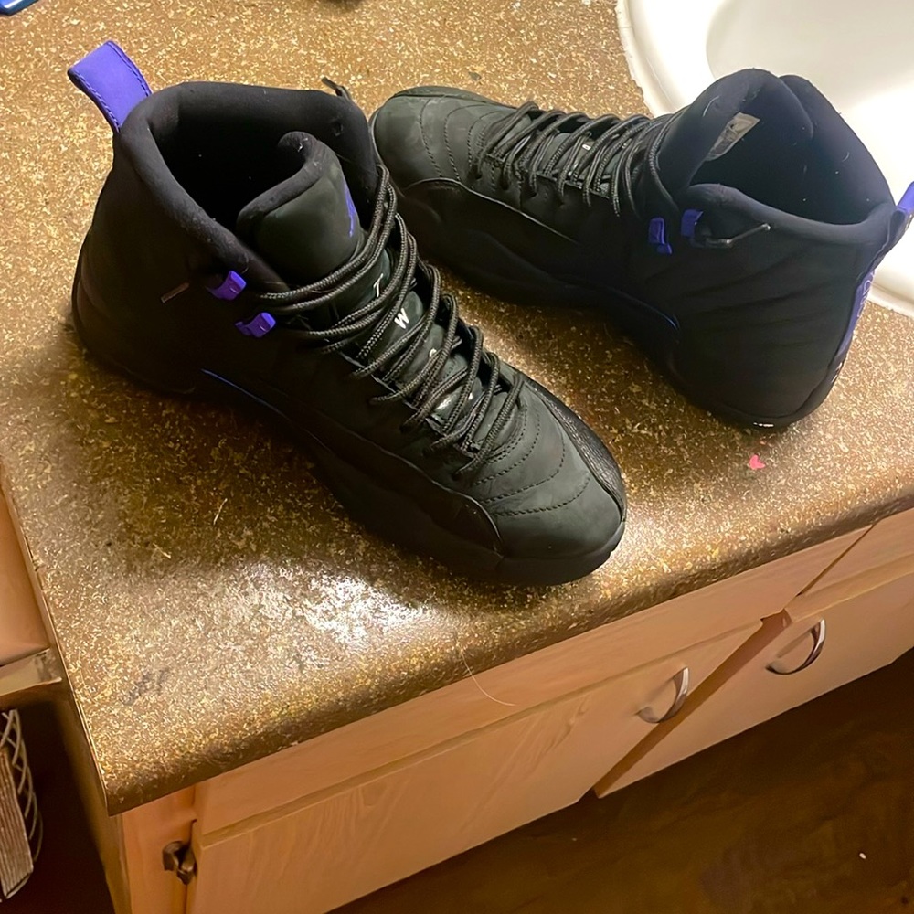 Black and purple Jordan jumpmans size 8.5